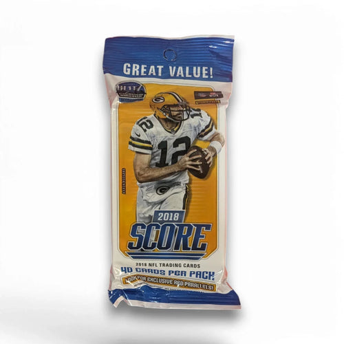 A sealed pack of 2018 Panini Score Football trading cards featuring an image of an NFL player on the front.