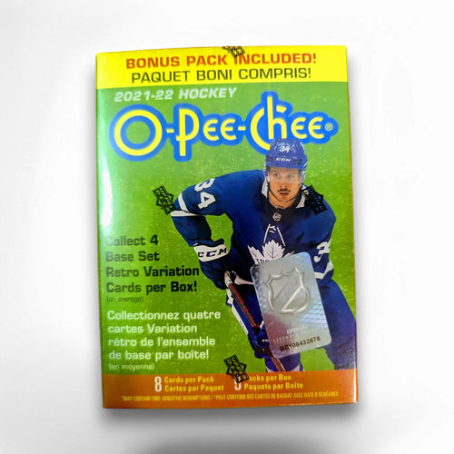 A sealed blaster box of 2021-22 O-Pee-Chee Hockey cards with a image of a hockey player on the packaging and text highlighting the inclusion of a bonus pack.