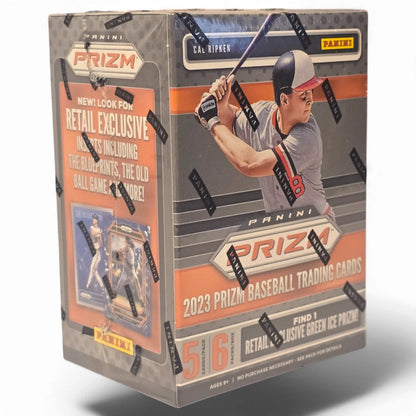 A sealed retail blaster box of 2023 Panini Prizm Baseball cards featuring images of baseball players and the box's title.