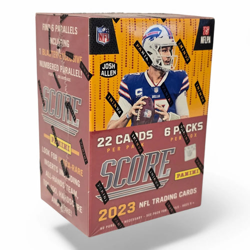A sealed blaster box of 2023 Panini Score Football cards featuring images of NFL players and branding elements.