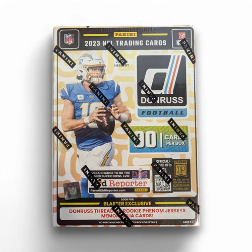 A sealed blaster box of 2023 Panini Donruss Football cards featuring images of football players and branding elements like jerseys and a football.