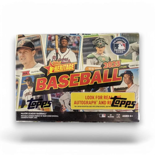 A sealed blaster box of 2023 Topps Heritage Baseball cards featuring images of baseball players and the text 'Look for Real Autographs and Relic Cards!'.