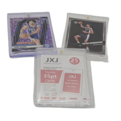Basketball trading cards with protective cases on a white background